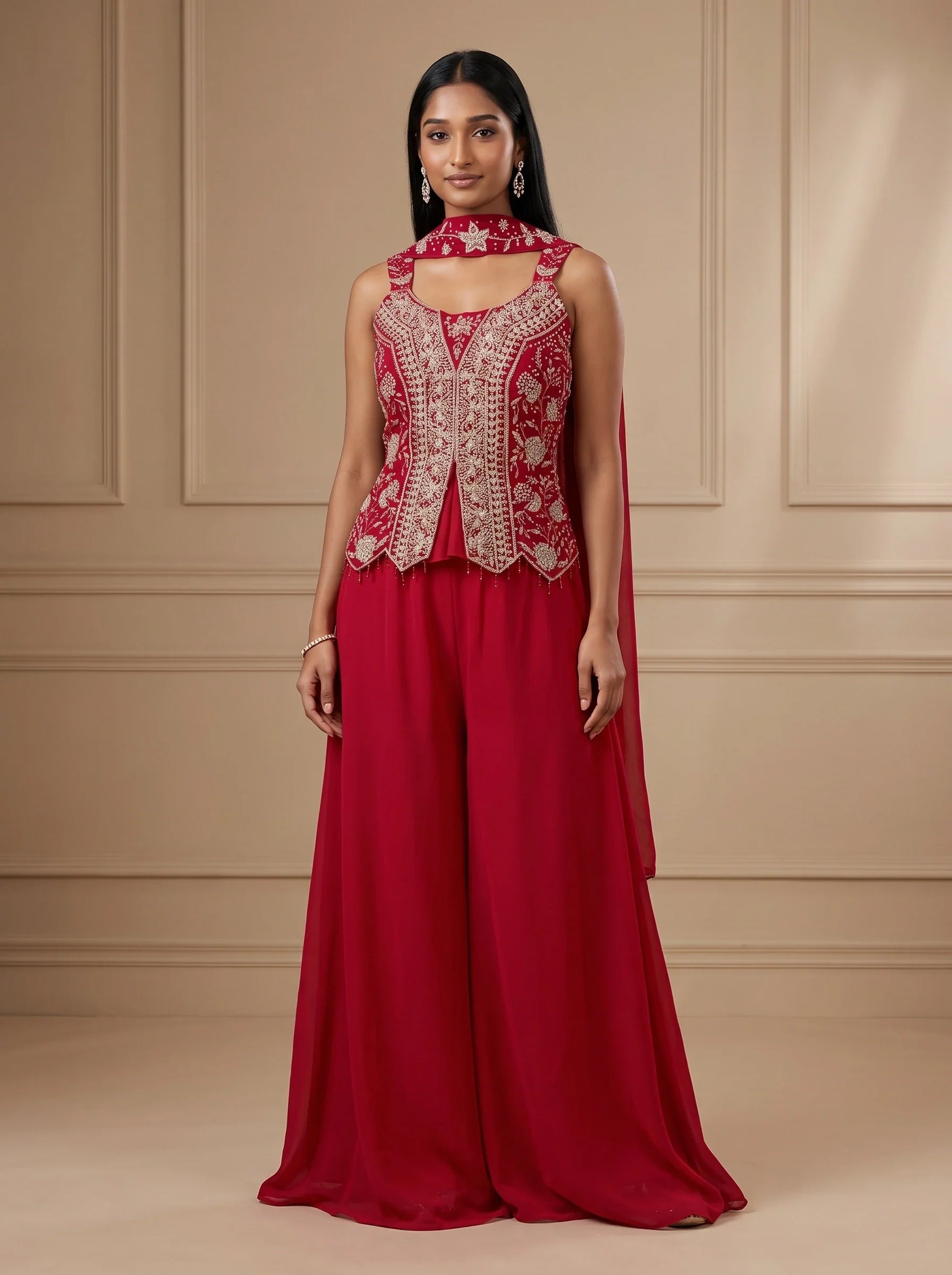 Model wearing deep pink georgette floral stone embroidered sharara set with matching dupatta