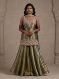 Model wearing olive green tissue silk embroidered sharara set with metallic gold sheen and matching dupatta