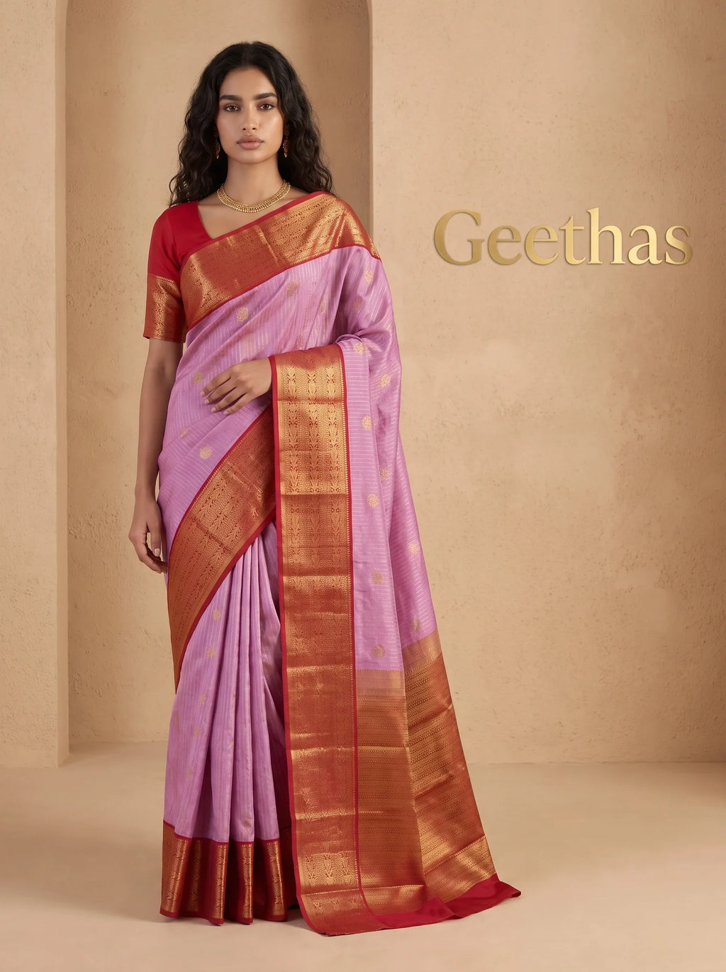 Model wearing a lilac pink soft silk saree with gold-toned woven motifs and a wide reddish zari border